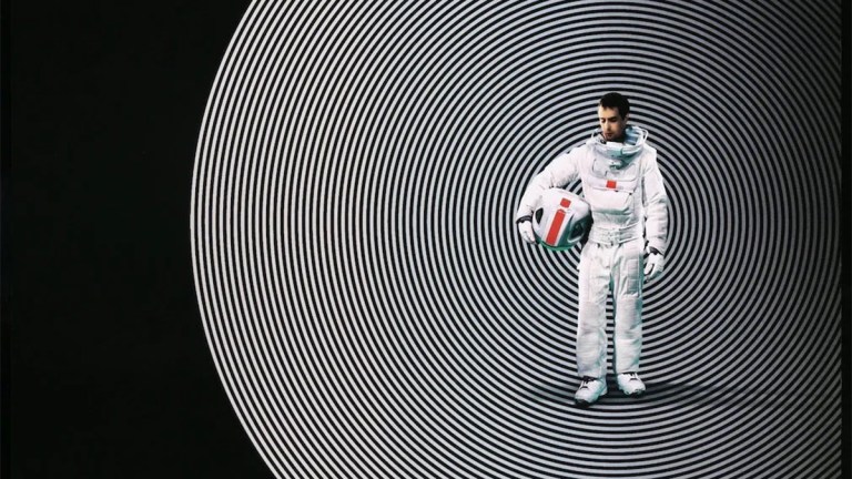 Cropped detail of Sam Rockwell in a spacesuit for the poster for 2009 movie Moon