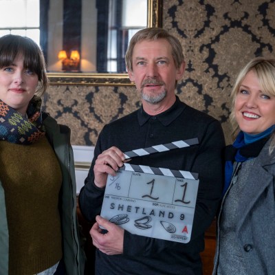 Alison O'Donnell, Ian Hart and Ashley Jensen holding a clapperboard for Shetland Series 9