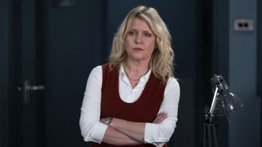 Ashley Jensen wearing a white shirt and red tank top as DI Ruth Calder in Shetland series 9