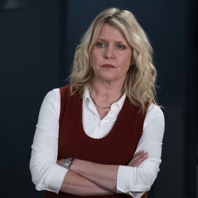 Ashley Jensen wearing a white shirt and red tank top as DI Ruth Calder in Shetland series 9
