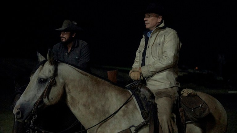 John Dutton (Kevin Costner) on a horse at night in Yellowstone season 5.
