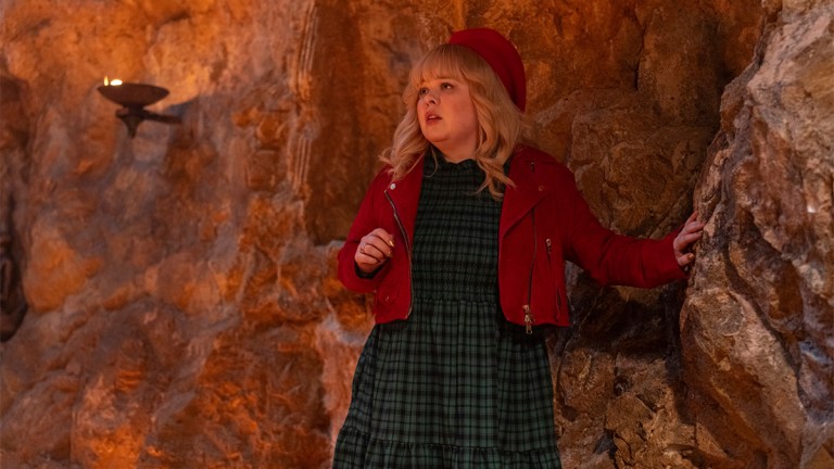 Nicola Coughlan wearing a red jacket and beret in Doctor Who Christmas special "Joy to the World"