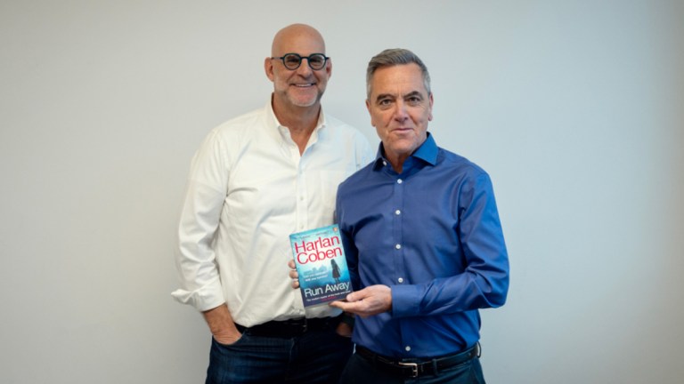 Harlan Coben and James Nesbitt with a copy of Coben&rsquo;s novel Run Away