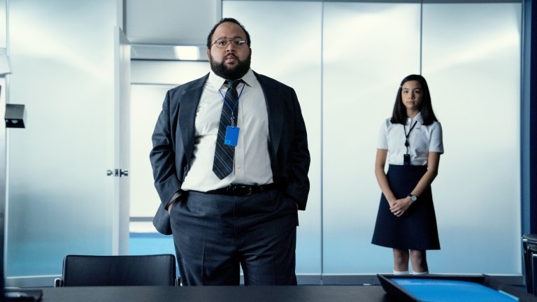 Dylan G (Zach Cherry) and Miss Huang (Sarah Bock) in the office in Severance season 2.