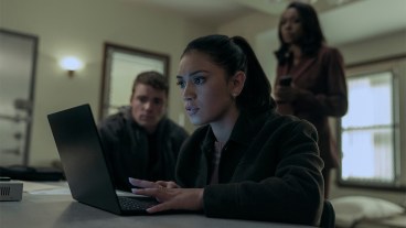 Rose on a laptop with Peter and Catherine in the background in The Night Agent season 2