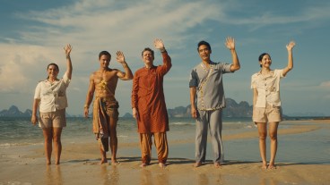 Morgana O'Reilly, Arnas Fedaravičius, Christian Friedel, Dom Hetrakul, Lalisa Manobal stand on the beach in season 3 of The White Lotus