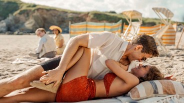 A couple embracing on a beach in BBC One's Towards Zero