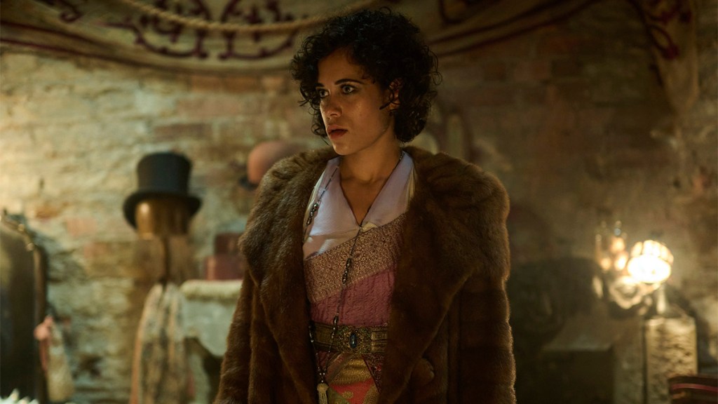Umi Meyers wearing a dress and fur coat in BBC One&rsquo;s Dope Girls