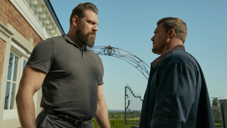 Paulie (Oliver Richters) and Reacher (Alan Ritchson) stand off in season 3 of Reacher