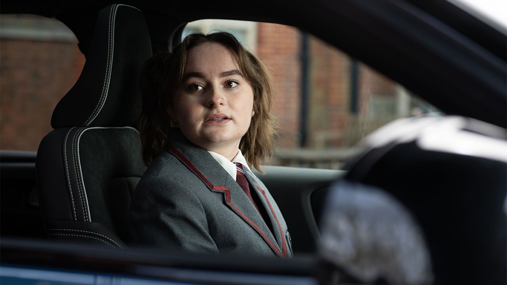 PIXIE DAVIES as Taylor Cooper
