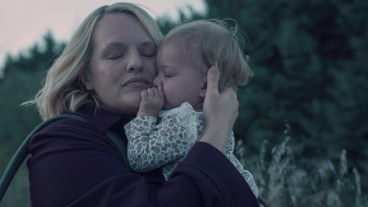 June Osborne (Elisabeth Moss) holds her daughter Nichole in The Handmaid's Tale