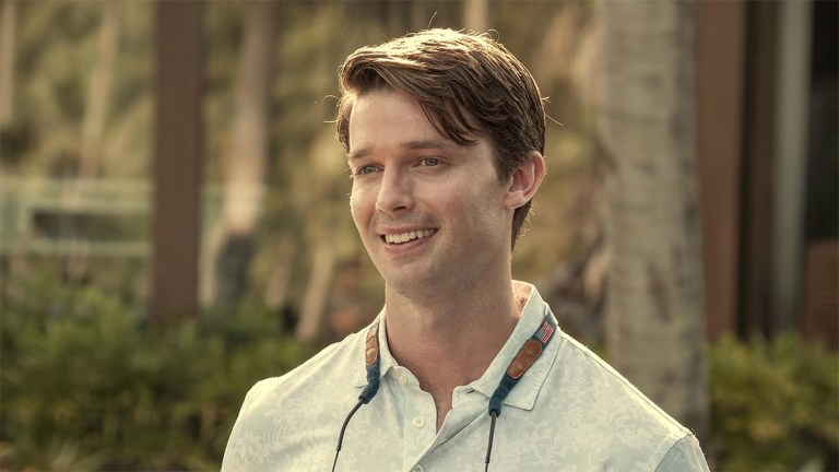 A handsome white man smiling and wearing a polo shirt