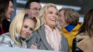Juno Temple and Hannah Waddingham sit in the AFC Richmond stands in "Ted Lasso"