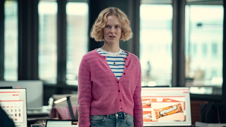 Rosy McEwen with short blonde hair and a pink sweater in Black Mirror season 7 episode Bete Noire