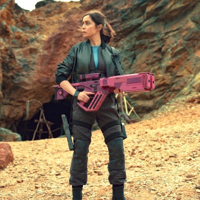 Nanette Cole (Cristin Milioti) hold a pink rifle on an alien world in Black Mirror "USS Callister: Into Infinity."
