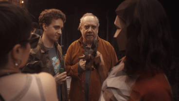 Declan Mason and Paul Giamatti enter into a photograph in the Black Mirror episode "Eulogy."