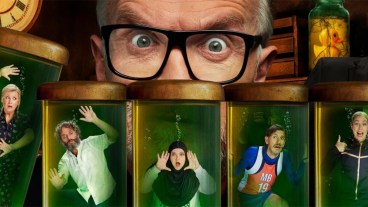 Rosie Ramsey, Jason Mantzoukas, Fatiha El-Ghorri, Mat Baynton and Stevie Martin in scientific jars while a giant Greg Davies' eyes stare at them