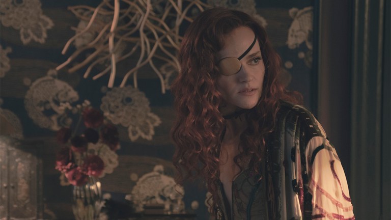 Madeline Brewer in a gold eyepatch and nightwear in The Handmaid&rsquo;s Tale season six