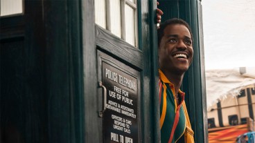 A smiling Ncuti Gatwa emerging from the TARDIS door in Doctor Who season 2 episode "The Story & The Engine"