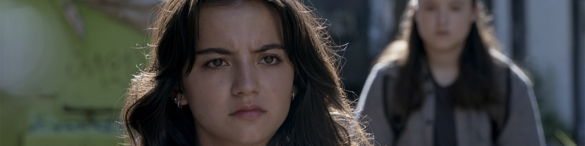Dina (Isabela Merced) and Ellie (Bella Ramsey) on the streets of Seattle in The Last of Us season 2