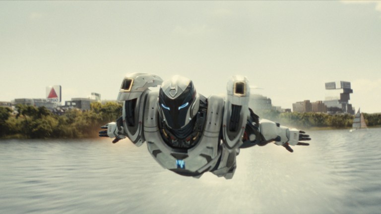 Ironheart soaring over the water in Disney+'s Ironheart
