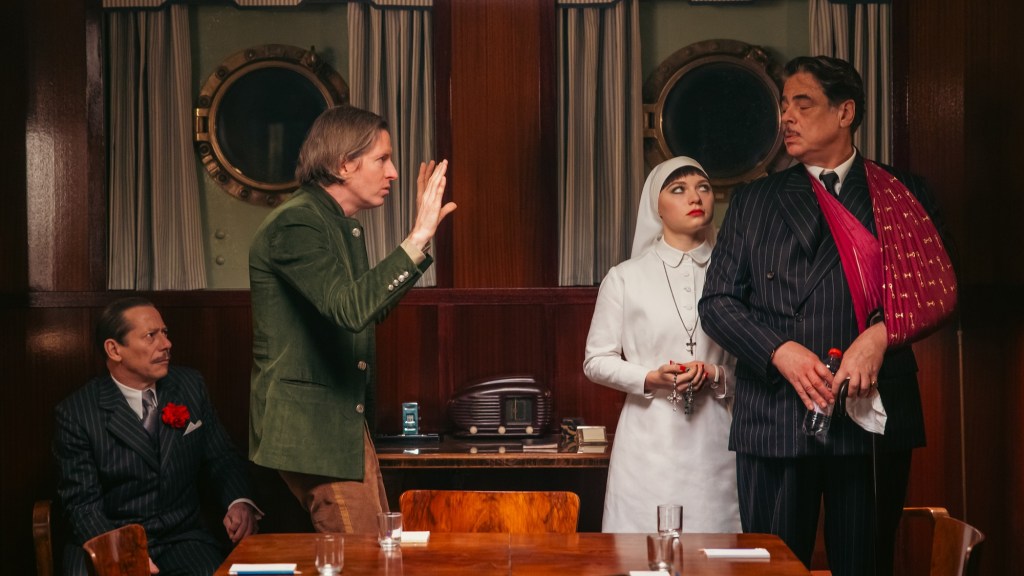 Wes Anderson directing Benicio del Toro in The Phoenician Scheme