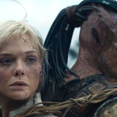 Elle Fanning and Predator in Predator: Badlands
