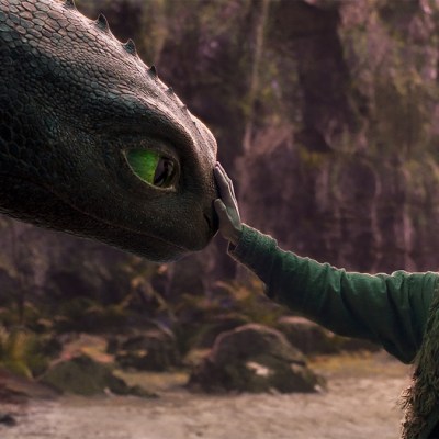 An image from 2025's How to Train Your Dragon with a boy gently booping a dragon's nose.