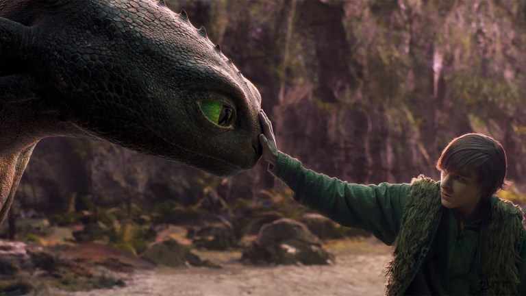 An image from 2025's How to Train Your Dragon with a boy gently booping a dragon's nose.