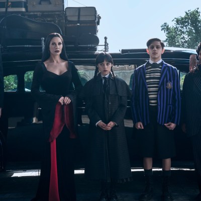 Wednesday. (L to R) Joonas Suotamo as Lurch, Catherine Zeta-Jones as Morticia Addams, Jenna Ortega as Wednesday, Isaac Ordonez as Pugsley Addams, Thing, Luis Guzmán as Gomez Addams in episode 201 of Wednesday.