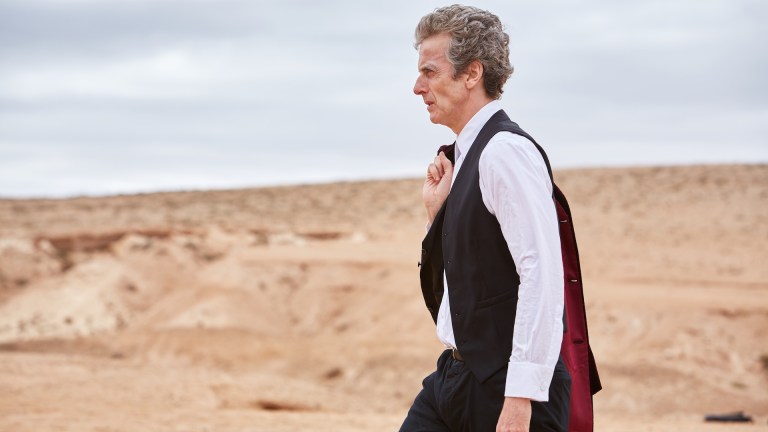 Picture shows: Peter Capaldi as the Doctor walking through the desert.