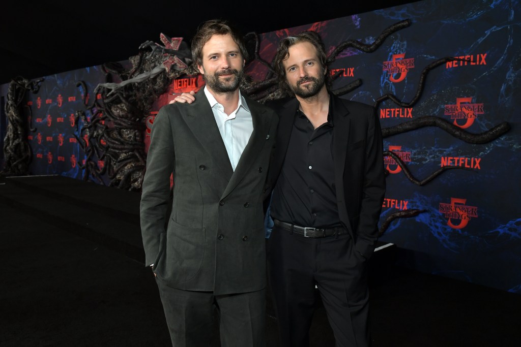 HOLLYWOOD, CALIFORNIA - NOVEMBER 06: (L-R) Ross Duffer and Matt Duffer attend Netflix's "Stranger Things" Season 5 World Premiere at TCL Chinese 6 Theatres on November 06, 2025 in Hollywood, California. (Photo by Charley Gallay/Getty Images for Netflix)