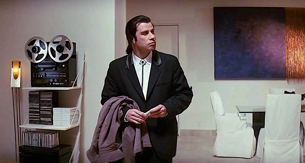 John Travolta in Pulp Fiction looking around