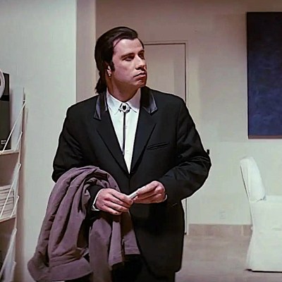 John Travolta in Pulp Fiction looking around