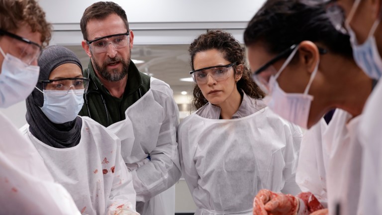 Overriding Al-Hashimi, Dr. Robby encourages Samira and Garcia through the procedure.