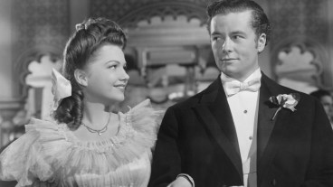 (Original Caption) Anne baxter arm in arm with Tim Holt in this scene from the 1942 RKO pictures release "The Magnificent Ambersons". Permission is herby granted to newspapers, magazines, and other periodicals to reproduce this photograph. Copyright 1942, RKO Pictures, Inc., Property of RKO Radio Pictures, Inc., leased for restricted use only.