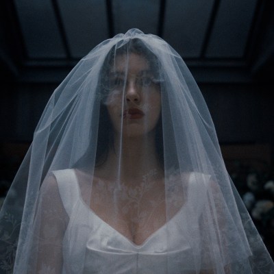 Camila Morrone as Rachel Harkin in Something Very Bad Is Going to Happen