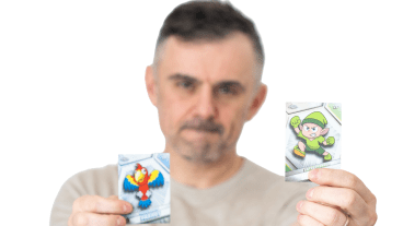 Gary Vee holding up two VeeFriends cards.
