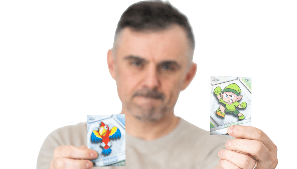 Gary Vee holding up two VeeFriends cards.