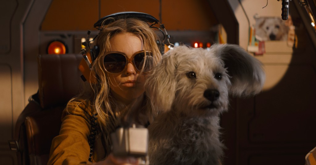 Milly Alcock as Supergirl with Krypto