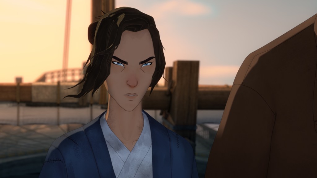 "Animated person with blue eyes and brown hair in a blue robe, standing outdoors on a dock at sunset, looking intensely forward; another figure partially visible on the right."
Blue Eye Samurai S2. Maya Erskine as Mizu in Blue Eye Samurai S2. Cr. COURTESY OF NETFLIX © 2026