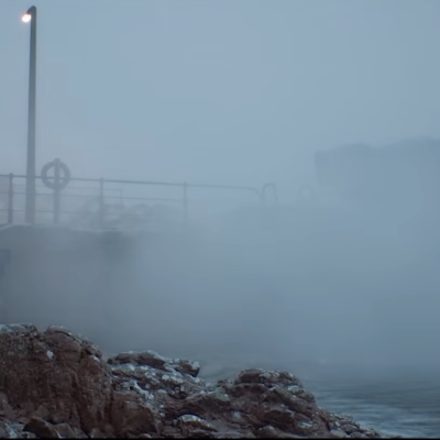 A foggy beach town in Silent Hill Downfall.