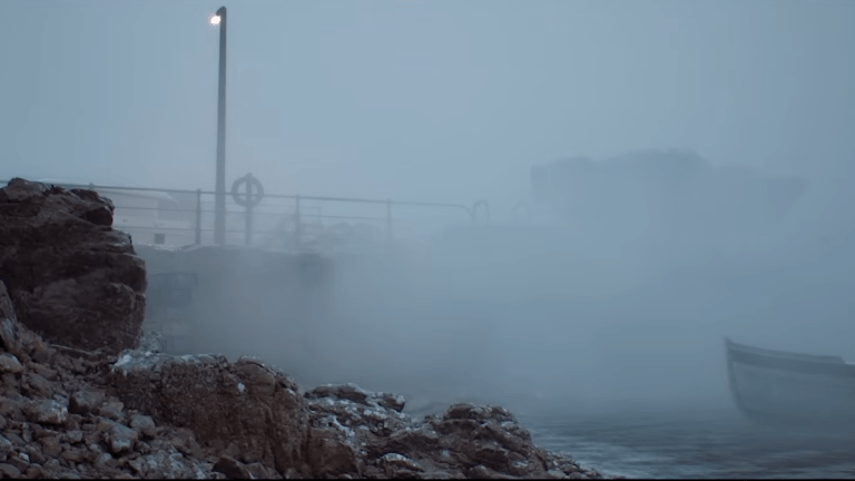 A foggy beach town in Silent Hill Downfall.